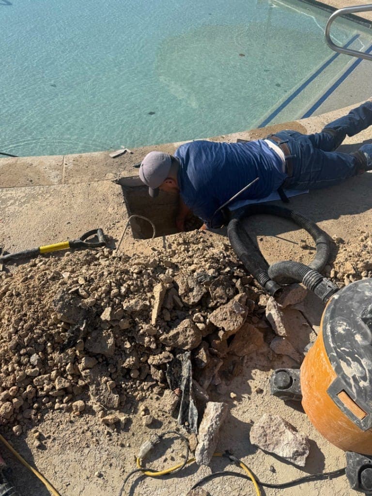 Diver performing underwater pool leak inspection in Central Texas
