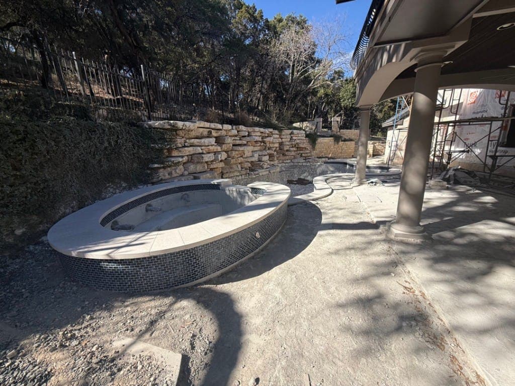Pool renovation crew applying new plaster finish in Central Texas
